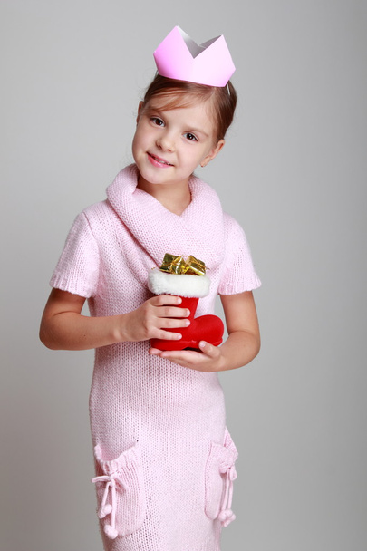 Child holding Christmas boot - Foto, Imagen