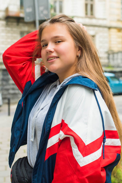Portrait of young attractive cute teenage girl looking at camera smiling with urban lifestyle concept. Glue a fool. Crazy funny teenager. - Φωτογραφία, εικόνα