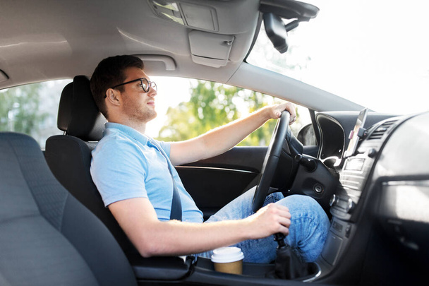 man or driver in glasses driving car in summer - Foto, Bild