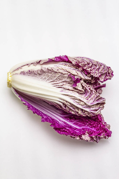 Ripe single purple Napa (chinese) cabbage. Fresh whole head of cabbage. Isolated on white background - Photo, Image