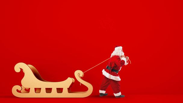 Santa Claus arrastra un gran trineo dorado sobre un fondo rojo
 - Foto, imagen