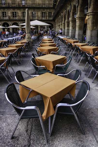 TERRACE TABLES OF BAR IN THE PLACE OF CITY IN SPAIN - Photo, Image