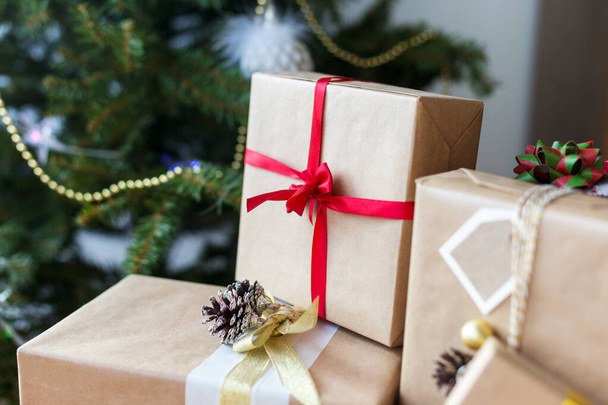 Gift boxes with christmas tree at background - Photo, Image
