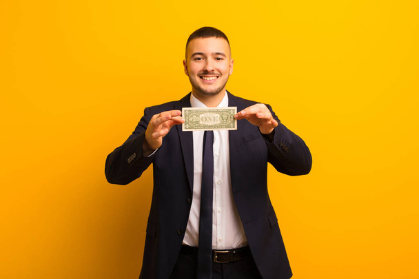 young handsome businessman  against flat background money concept - Photo, image