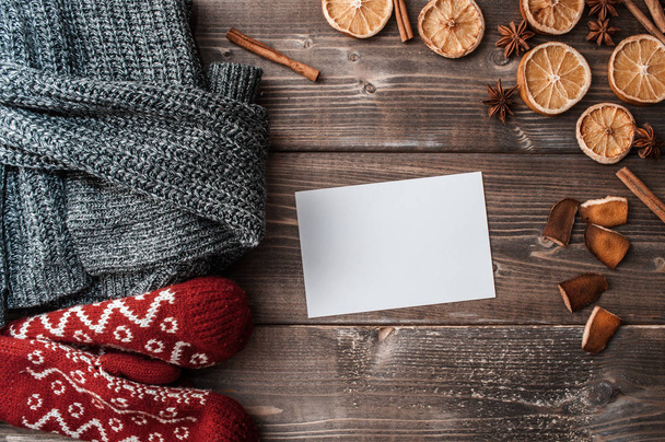  winter flatlay with cozy home sweater, mittens, blank greeting  - Zdjęcie, obraz