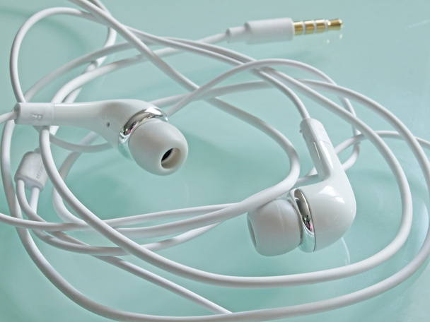 Wrapped earbud headphones - Photo, Image