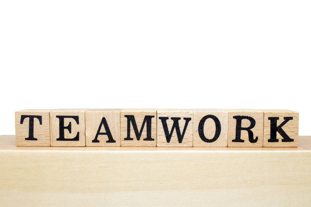 Business Concept : Teamwork words on wooden block isolated on white background. - Photo, Image