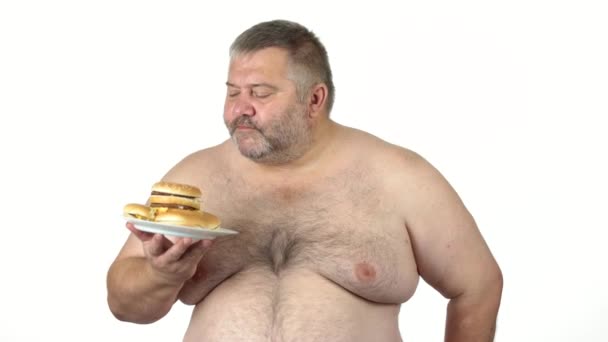 Fat man holding plate with burgers. - Footage, Video