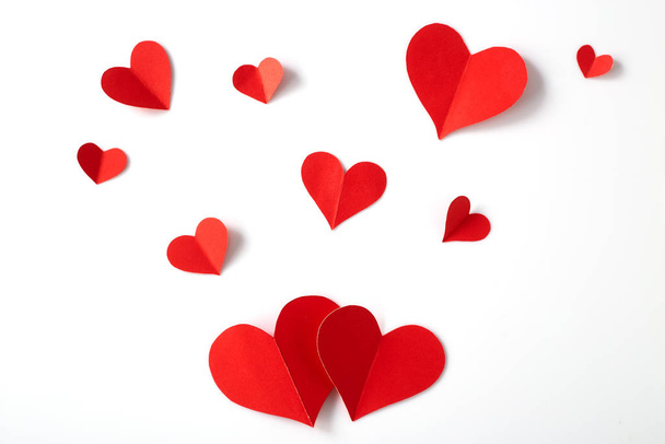 Red paper hearts on white background - Foto, imagen