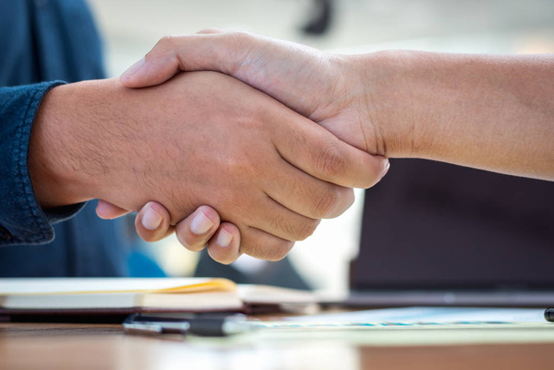 Businessmen shaking hands during a meeting. Handshake deal business corporate. - 写真・画像