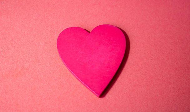 Red heart with letter words of give isolated on pink background. Giving, sharing, charities and donate concept - Foto, Imagen