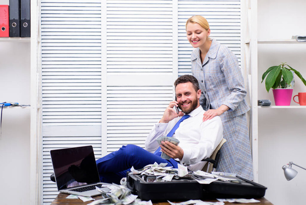 successful partnership deal. luxury and richness. accountant in office. net profit. man speak on phone. business success. happy couple count money. handsome businessman millionaire with secretary - Photo, Image