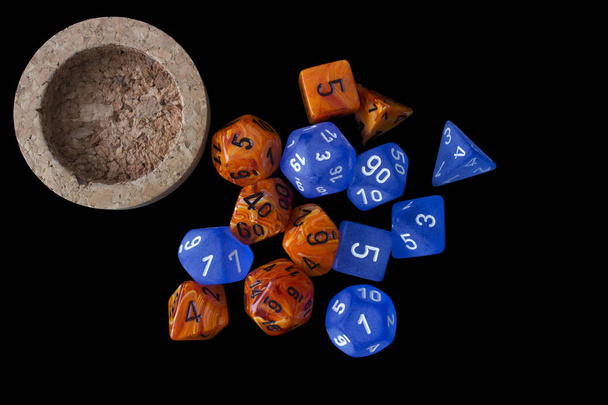 2 RPG sets orange/blue for playing role playing games on black background. - Photo, Image