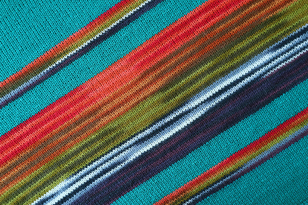 Diagonal Patterns and the Texture of Turquoise Blue with Red and Green Striped Alpaca Knitted Wool Fabric - Photo, Image