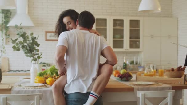 Erotic couple making foreplay gentle at home. Brutal man kissing woman on neck. - Materiał filmowy, wideo