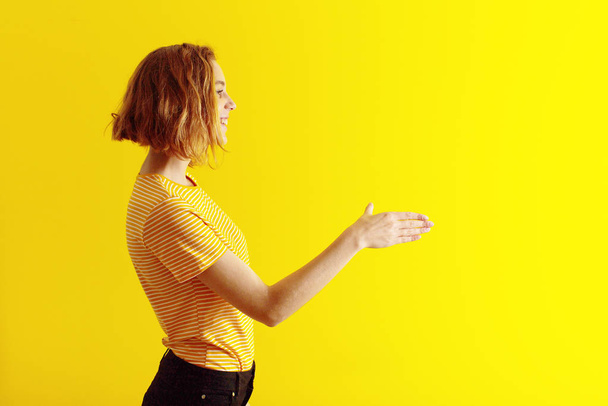 young blonde woman  against flat color wall - Foto, Imagem