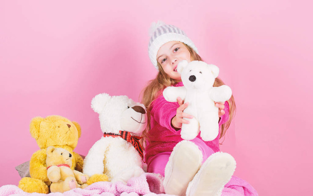 Toy every child dreaming. Happy childhood concept. Child small girl playful hold teddy bear plush toy. Why kids love stuffed animals. Kid little girl play with soft toy teddy bear on pink background - Photo, Image
