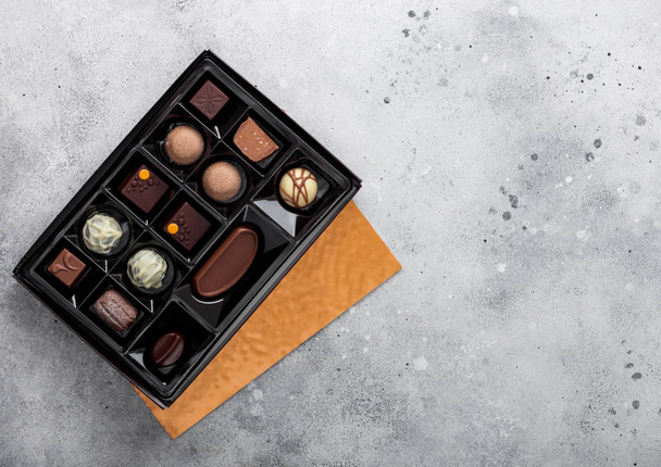 Box of Luxury Chocolate candies selection on light background. White, dark and milk chocolate assortment. - Photo, image