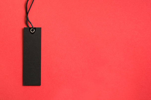 Black friday shopping tag on red background . Concept Sale. View from above. - Foto, Imagen