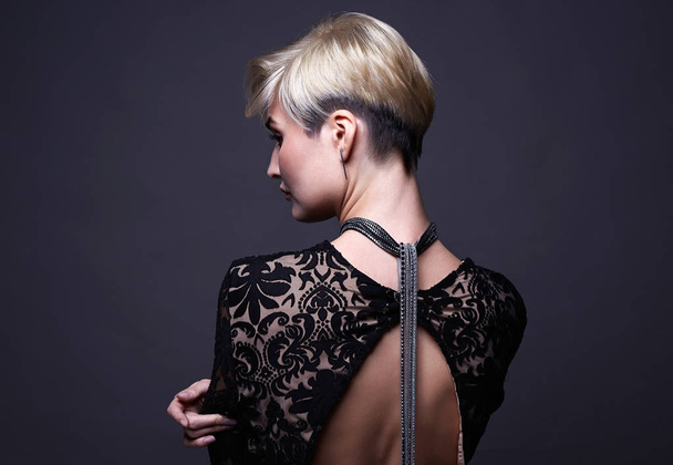 beautiful woman with short haircut. Dyed blonde hair girl - Фото, изображение