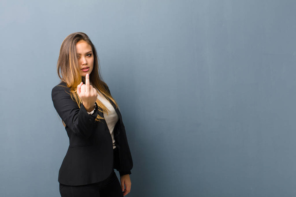 businesswoman feeling angry, annoyed, rebellious and aggressive, flipping the middle finger, fighting back - Foto, Imagem