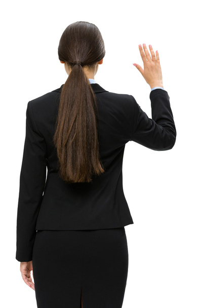 Backview of business woman waving hand - 写真・画像