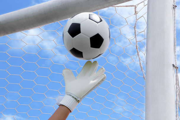 Goalkeeper's hands fail catching the soccer ball - Photo, Image