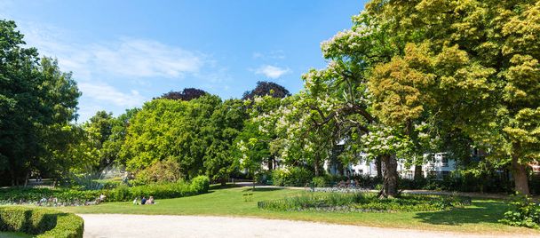 Park surrounded by greenery, old European town. Summer tourism and travels, famous europe landmark, popular places for tourists - Φωτογραφία, εικόνα