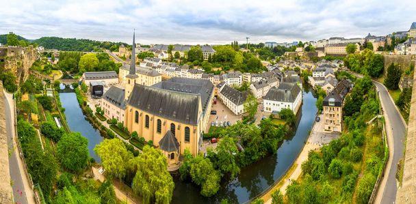 Luxembourg cityscape, ancient church on river, panorama. Old european architecture, medieval stone buildings, benelux country - Zdjęcie, obraz