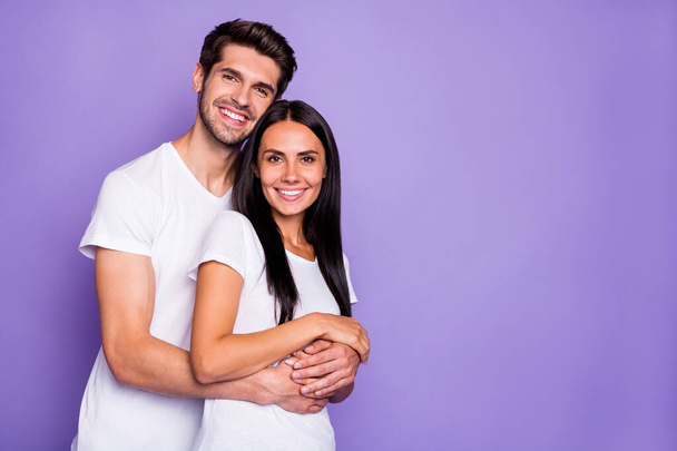 Close-up portrait of his he her she nice attractive charming affectionate cheerful cheery couple soulmate embracing spending honey moon isolated on purple violet lilac color pastel background - Foto, imagen