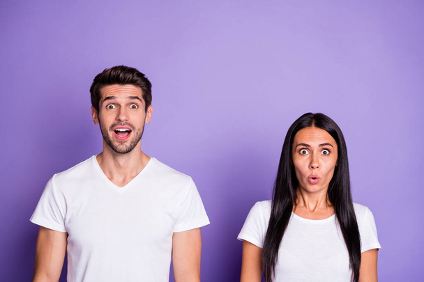 Close-up portrait of his he her she nice attractive lovely charming cheerful puzzled confused funny couple omg emotion expression isolated on purple violet lilac color pastel background - Photo, image