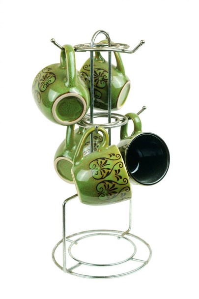 Green cofee glasses on a metal hanger - Photo, Image
