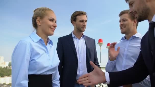Business woman and man shaking hands, work partners applauding celebrating deal - Footage, Video
