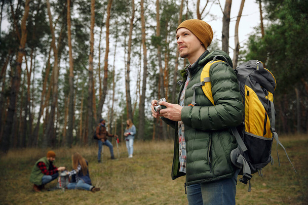 Group of friends on a camping or hiking trip in autumn day - Fotoğraf, Görsel