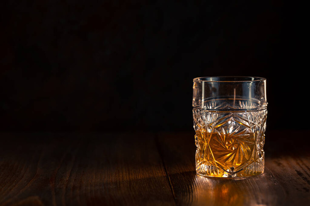 Whiskey in glass with ice - Фото, изображение