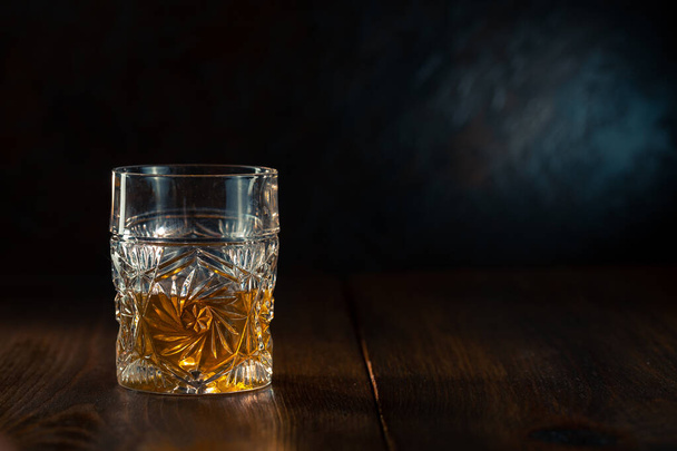 Whiskey in glass with ice - 写真・画像