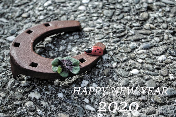 Happy new year wishes with a horseshoe - Photo, Image