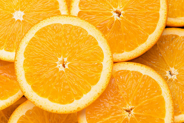 Muchas rodajas de naranja fresca, primer plano
 - Foto, Imagen
