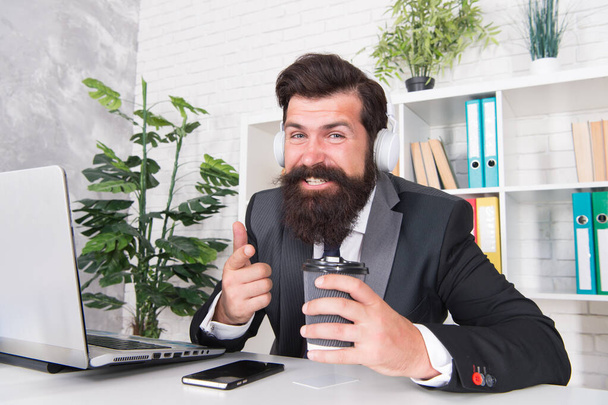 Encrypted communication app will protect your company secrets. Bearded man use wireless communication in office. Businessman establish online communication with customers. Business communication - 写真・画像