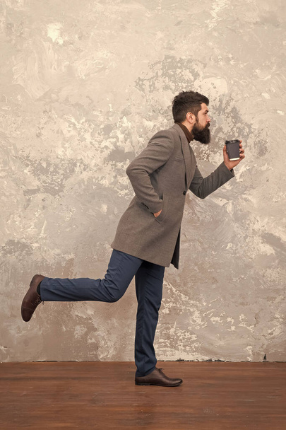 Casual style. Modern life. trendy man with beard. Brutal bearded hipster in denim wear. Male fashion model. Mature businessman drink take away coffee. Hurrying to be in trend. hurrying to work - 写真・画像