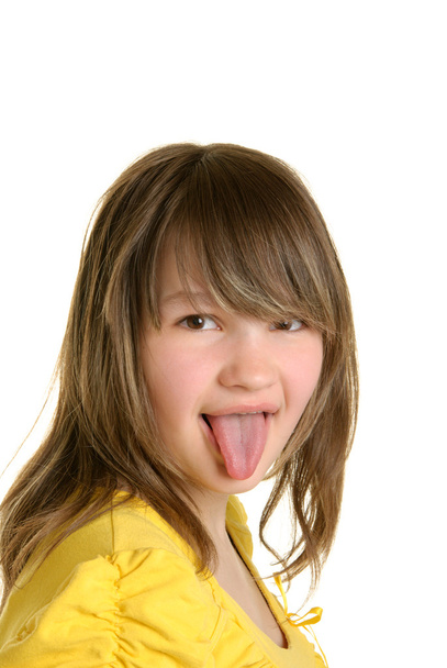 Beautiful girl puts out tongue - Photo, image