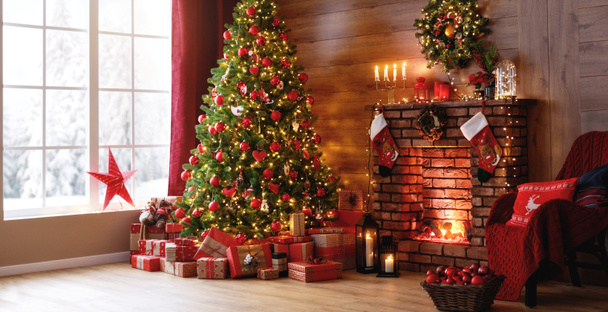 interior christmas. magic glowing tree, fireplace, gifts   - Photo, Image