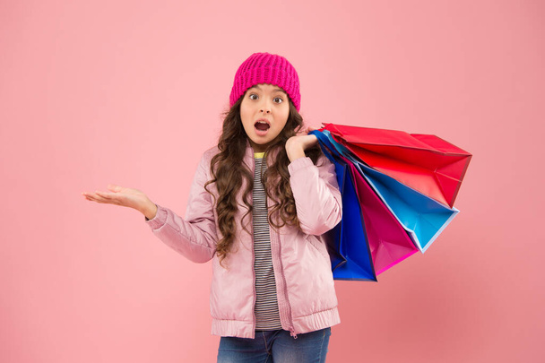 Falling prices. Surprised shopper presenting product pink background. Small child on shopping sale. Season sale. Best choice. Black Friday and cyber monday sale. Big autumn sale, copy space - Photo, image