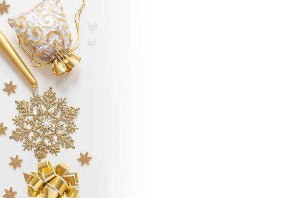 Christmas decorations in gold colors on white background - Fotografie, Obrázek