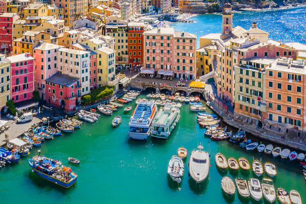 Aerial view of Camogli. Colorful buildings near the ligurian sea beach. View from above on boats and yachts moored in marina with green blue water. - Photo, Image