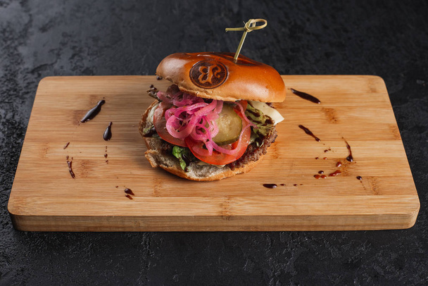 tasty hamburger with tomato and beef  - Photo, Image