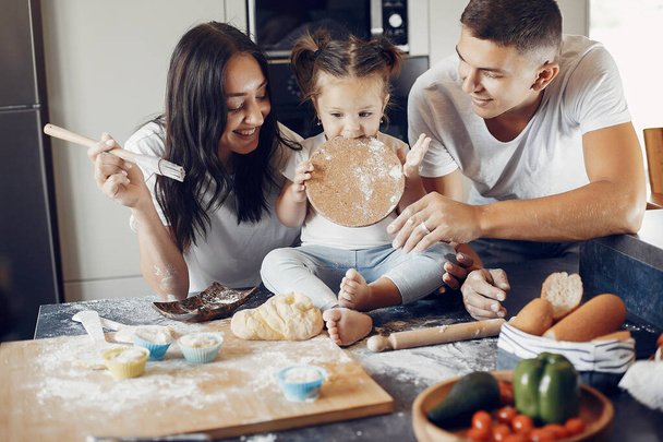 Family cook the dough for cookies at the kitchen - Fotoğraf, Görsel