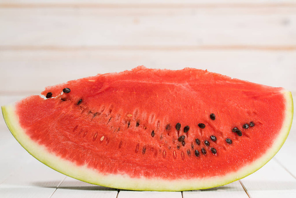 a slice of watermelon on a white background - 写真・画像