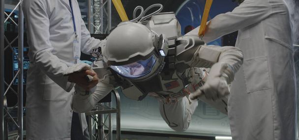 Scientists and astronaut testing zero-gravity conditions - Photo, Image