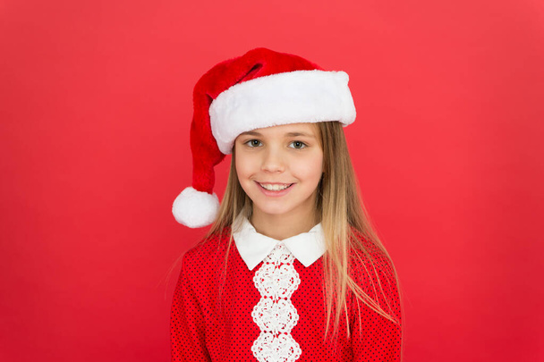 Christmas shopping. New year party. Santa claus girl. Happy winter holidays. Present for xmas. Carefree childhood. Little girl child in santa red hat. Believe in Santa Claus. Childhood memories - Φωτογραφία, εικόνα